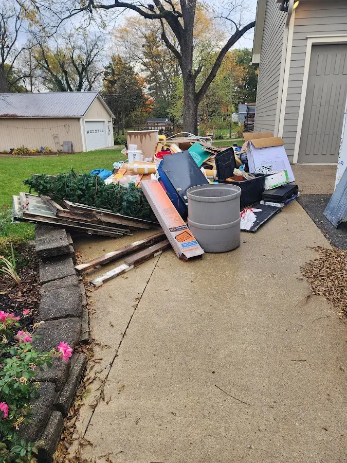 Dumpster being loaded with debris for Residential Dumpster Rental in Tanglewilde